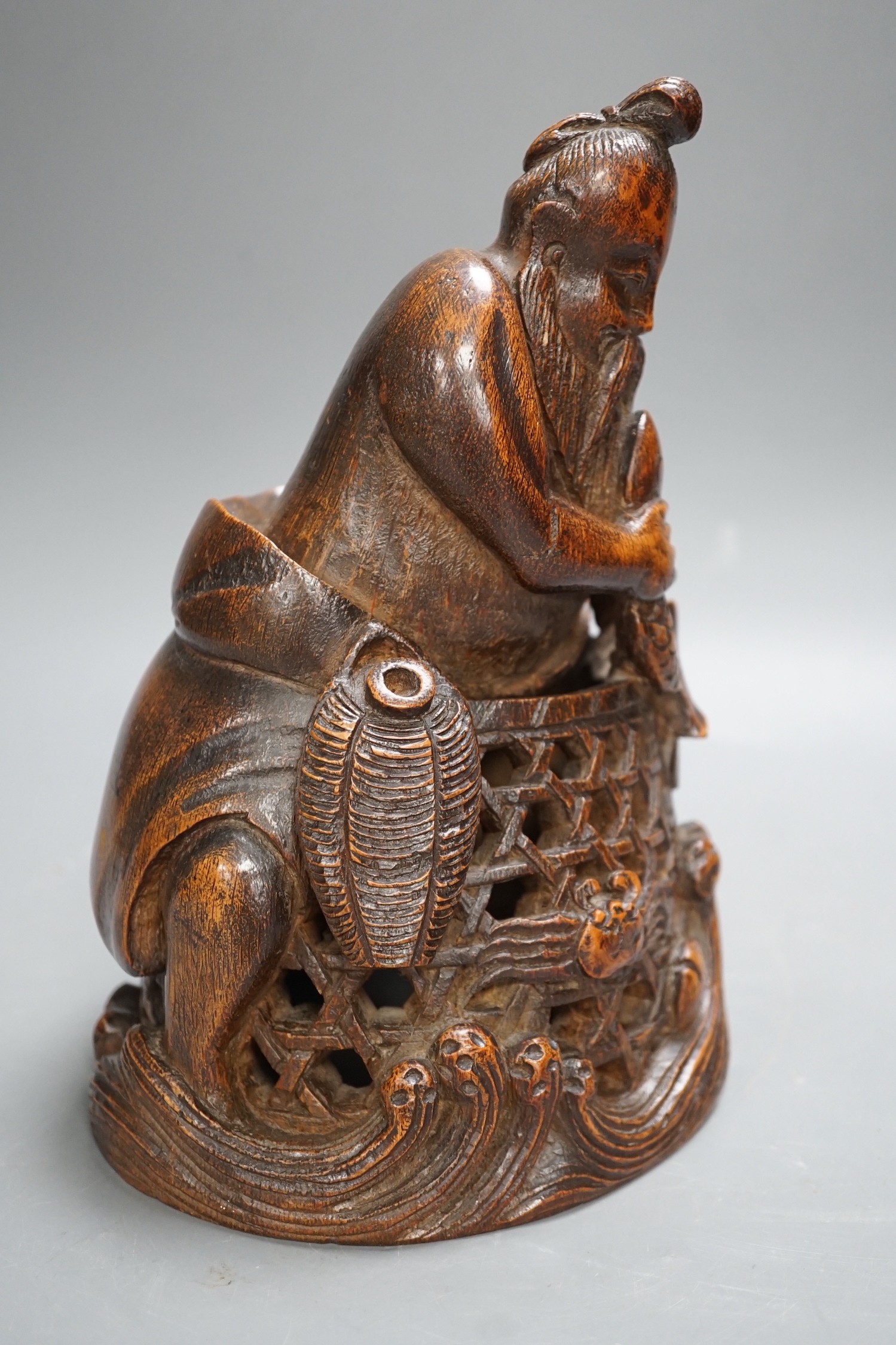 A Chinese bamboo figure of a fisherman, 19th century, 23cms high